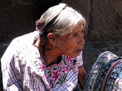 23 Elderly wwoman selling textiles in Solala
