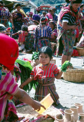 59 Girl learning the tricks of the trade from her mother at the market place 800