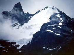 38 glacier peaking through the clouds in chile 800