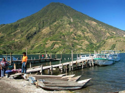 70 small boats anchored in san pedro in front of a volcano in guatemala 800