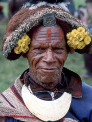 12 Head Dress Made of Animal Fur and a Kina Shell around his Neck 800