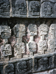 19 mayan wall of faces in the ruins of tulum
